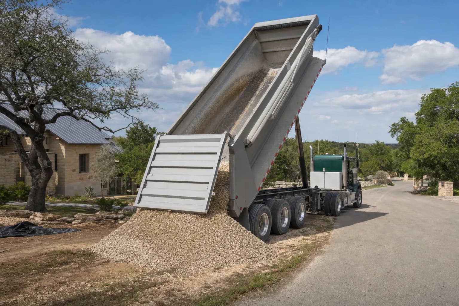Dump truck delivering gravel