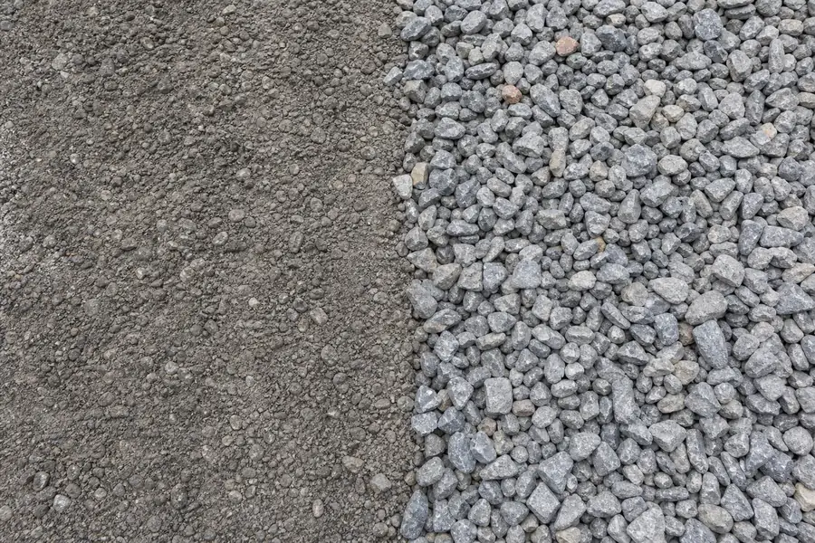 Split image of crusher run with fines on one side and clean #57 stone on the other