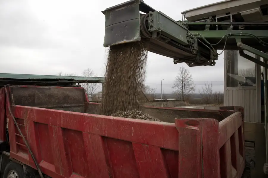 Dump truck bed being loaded at a scale house